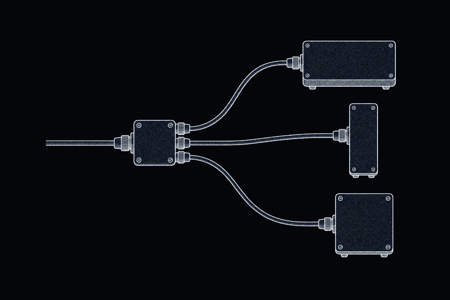 A small junction box seen from above with one cable in and three cables fanning out to three different bench instruments.