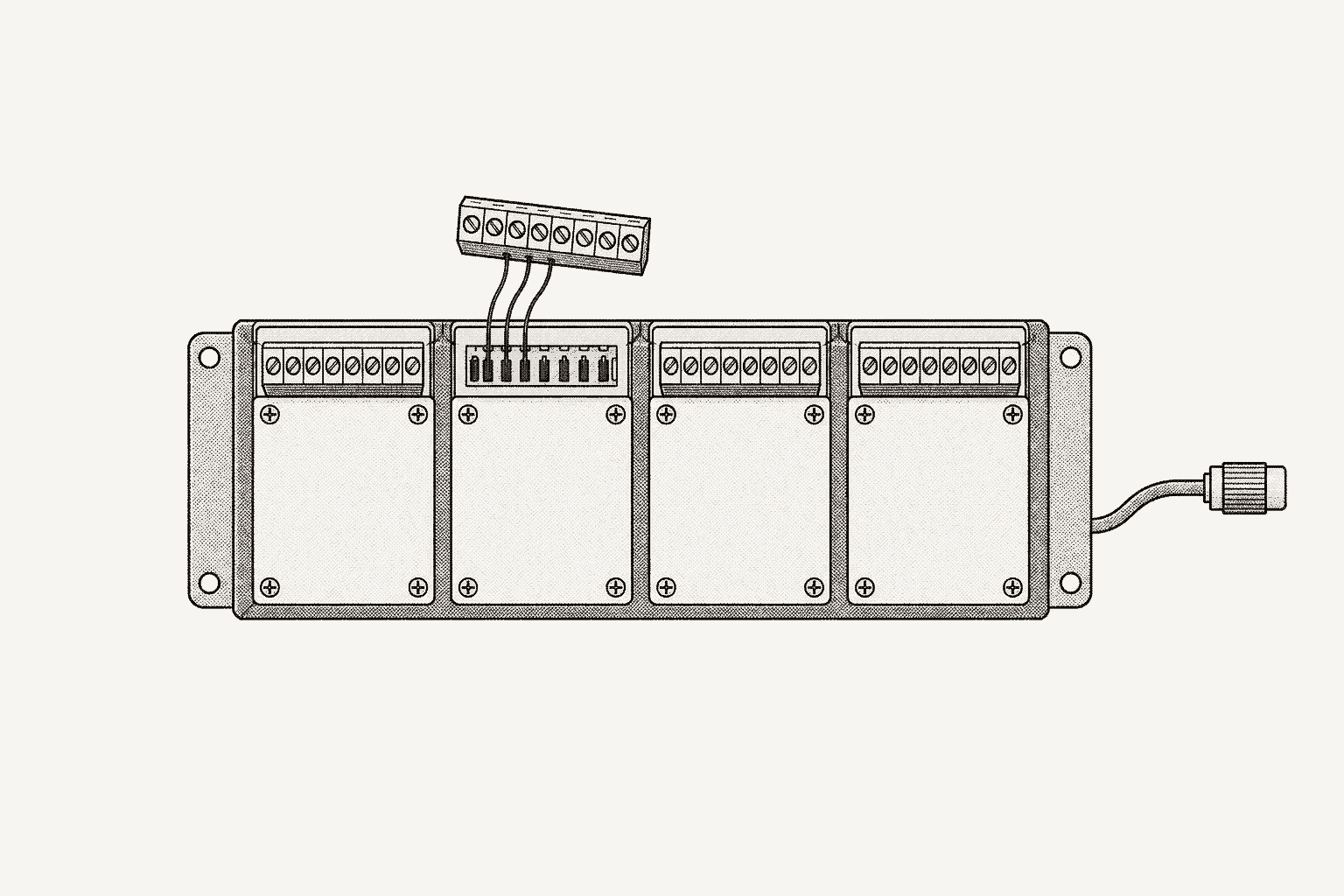 A compact data-acquisition chassis seen from above, four I/O modules seated and one screw-terminal block lifted off.